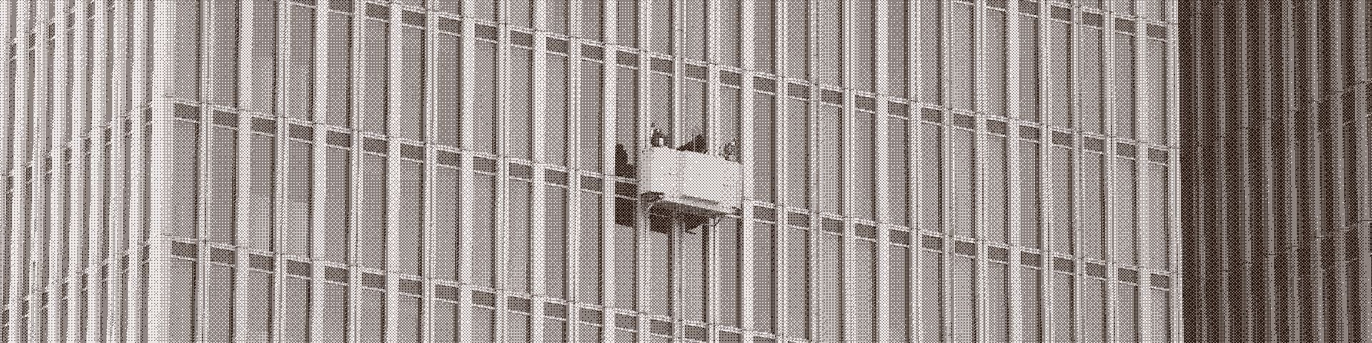 Kujutatud on inimene, kes peseb aknaid.